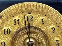 10739761-close-up-of-the-minute-hand-of-a-black-and-gold-antique-mantle-clock-about-to-strike-12-o-clock[1]
