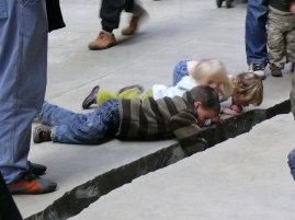 Children peering into the shibboleth at the Tate Modern in London
